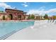 Community pool area with ample seating, a pergola, and a clean, inviting swimming space at 9724 Cantabria Pt, Lone Tree, CO 80124