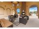 Relaxing poolside lounge area with comfortable seating, a fireplace, and scenic views of the pool at 9724 Cantabria Pt, Lone Tree, CO 80124