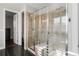 Shower features dual shower heads and built-in bench at 9724 Cantabria Pt, Lone Tree, CO 80124