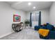 Bright sitting room with cozy seating area and natural light at 9724 Cantabria Pt, Lone Tree, CO 80124