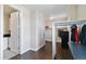 Spacious walk-in closet with custom storage solutions and adjacent laundry area at 9724 Cantabria Pt, Lone Tree, CO 80124