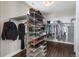Spacious walk-in closet with shelving and hanging racks at 9724 Cantabria Pt, Lone Tree, CO 80124