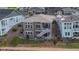 Aerial view of a two-story home with a well-maintained yard, deck, and surrounding neighborhood at 8726 Holman Cir, Arvada, CO 80005