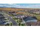 Aerial view of residential neighborhood featuring well-maintained lawns and mountain views at 8726 Holman Cir, Arvada, CO 80005