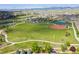 Expansive community park featuring a baseball field, playground, and walking paths against a mountain backdrop at 8726 Holman Cir, Arvada, CO 80005