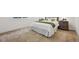 Bright bedroom with soft carpet, bedside tables, and a comfortable bed with decorative pillows at 8726 Holman Cir, Arvada, CO 80005