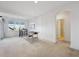 Spacious bonus room with game table, natural light, and access to a bathroom at 8726 Holman Cir, Arvada, CO 80005