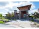 Exterior front view of the community clubhouse with stone accents, professional landscaping and a welcoming entrance at 8726 Holman Cir, Arvada, CO 80005