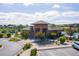 Exterior view of the clubhouse and well-manicured landscaping by community pool and playground at 8726 Holman Cir, Arvada, CO 80005