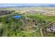 Aerial view of community featuring pond, park, walking trails, playground and beautiful landscaping at 8726 Holman Cir, Arvada, CO 80005
