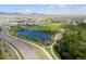 Aerial view of community featuring pond, park, baseball field, playground and beautiful landscaping at 8726 Holman Cir, Arvada, CO 80005
