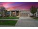 Charming single-Gathering home with a two-car garage and a stone and siding exterior at 8726 Holman Cir, Arvada, CO 80005