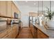 Spacious kitchen with modern stainless steel appliances, granite countertops, and wooden cabinets at 8726 Holman Cir, Arvada, CO 80005