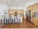Open kitchen with a breakfast bar, stainless steel appliances, and wooden cabinets at 8726 Holman Cir, Arvada, CO 80005