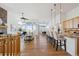 Bright and airy living room with hardwood floors, fireplace, and large windows at 8726 Holman Cir, Arvada, CO 80005