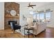 Comfortable living room with fireplace, hardwood floors, and lots of light at 8726 Holman Cir, Arvada, CO 80005