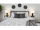 Comfortable main bedroom with large bed, modern wall decorations, and matching nightstands at 8726 Holman Cir, Arvada, CO 80005