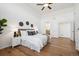 Spacious main bedroom with hardwood floors, modern décor, and ensuite bathroom access at 8726 Holman Cir, Arvada, CO 80005