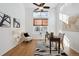 Bright office featuring neutral colors, a ceiling fan, and a large window with natural light at 8726 Holman Cir, Arvada, CO 80005