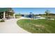Community playground with slides, swings, picnic tables and open green space for Gathering enjoyment at 8726 Holman Cir, Arvada, CO 80005