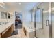 Bright bathroom featuring a soaking tub, shower, and dual sink vanity at 1542 Cherry St, Brighton, CO 80601