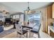 Charming dining area with backyard access and integrated open floor plan at 1542 Cherry St, Brighton, CO 80601
