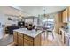 Modern kitchen with island seating opens to the dining and living areas at 1542 Cherry St, Brighton, CO 80601