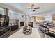 Inviting living room featuring a fireplace, comfortable seating, and an open layout flowing into the kitchen at 1542 Cherry St, Brighton, CO 80601