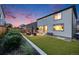 Spacious backyard with patio, artificial grass, and well-maintained landscaping at 16673 E Virginia Ave, Aurora, CO 80017
