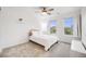 Bright bedroom featuring a twin bed with a white comforter, complemented by natural light from a dual windows at 16673 E Virginia Ave, Aurora, CO 80017