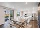 Eat-in kitchen with stainless steel appliances, granite countertops, a center island and outside access at 16673 E Virginia Ave, Aurora, CO 80017