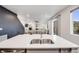 Gourmet kitchen with quartz counters, stainless appliances and an island with seating at 16673 E Virginia Ave, Aurora, CO 80017