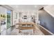 Bright eat-in kitchen featuring stainless steel appliances, granite countertops, and modern finishes at 16673 E Virginia Ave, Aurora, CO 80017