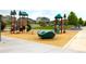 Community playground with various play structures and equipment at 16673 E Virginia Ave, Aurora, CO 80017