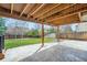 View of the back patio and yard, with view of the fence line and other homes at 6530 S Tabor St, Littleton, CO 80127