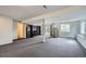 Finished basement offering versatile space, shelving, and access to the backyard at 6530 S Tabor St, Littleton, CO 80127