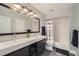 Bathroom features double vanity, shower-tub combo, and stylish fixtures at 6530 S Tabor St, Littleton, CO 80127