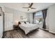 Bedroom featuring a ceiling fan, window, and grey toned flooring at 6530 S Tabor St, Littleton, CO 80127