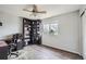 Bedroom featuring a corner bookcase, ceiling fan, and wood-look flooring at 6530 S Tabor St, Littleton, CO 80127