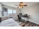 Bedroom featuring a ceiling fan, natural light, and work space at 6530 S Tabor St, Littleton, CO 80127