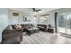 Spacious living room featuring lots of seating, recessed lighting, and a sliding door leading to the outside at 6530 S Tabor St, Littleton, CO 80127
