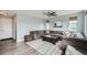 Living room with recessed lighting, wood floors, a grey couch, and a coffee table at 6530 S Tabor St, Littleton, CO 80127