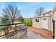 View of the back deck featuring wood flooring, a metal table and chairs, and access to the yard at 7333 S Dexter Way, Centennial, CO 80122