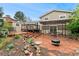 Outdoor patio area with dining seating, a pergola, and lush landscaping at 7333 S Dexter Way, Centennial, CO 80122