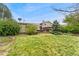 The expansive backyard features a patio, mature landscaping, and well-maintained lawn at 7333 S Dexter Way, Centennial, CO 80122