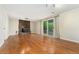 Finished basement with cozy fireplace, hardwood floors, and direct access to outdoor space at 7333 S Dexter Way, Centennial, CO 80122