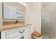 Bathroom featuring vanity with granite countertop and walk-in shower at 7333 S Dexter Way, Centennial, CO 80122