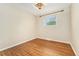 Empty bedroom featuring hardwood floors and a window at 7333 S Dexter Way, Centennial, CO 80122