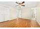 Empty bedroom featuring hardwood floors, closet and en suite bathroom at 7333 S Dexter Way, Centennial, CO 80122