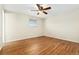 Empty bedroom featuring hardwood floors and a ceiling fan at 7333 S Dexter Way, Centennial, CO 80122